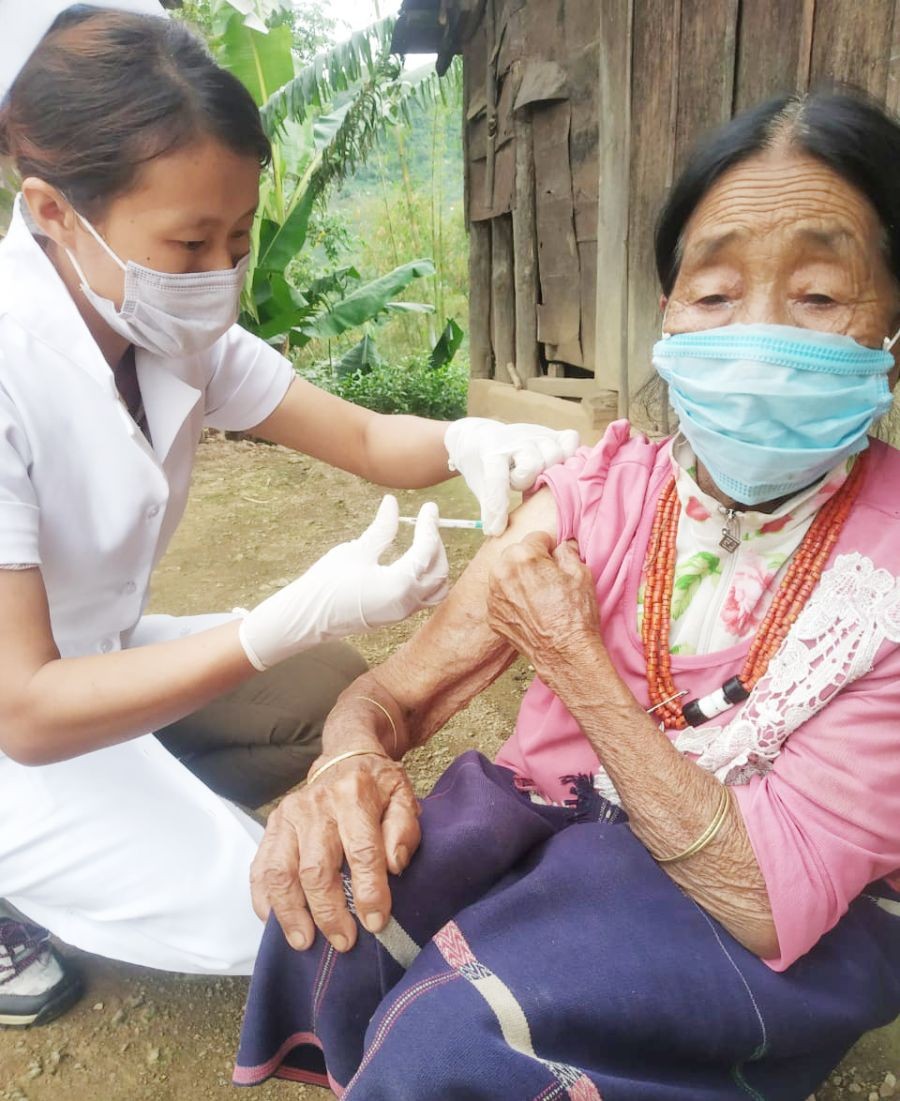 A 103-year old woman receiving her first dose of COVID-19 vaccine during home visit  by a Health Worker in Keltomi village under Aghunato block, Zunheboto on June 13. (Photo Courtesy: IEC Bureau, CMO Office Zunheboto)